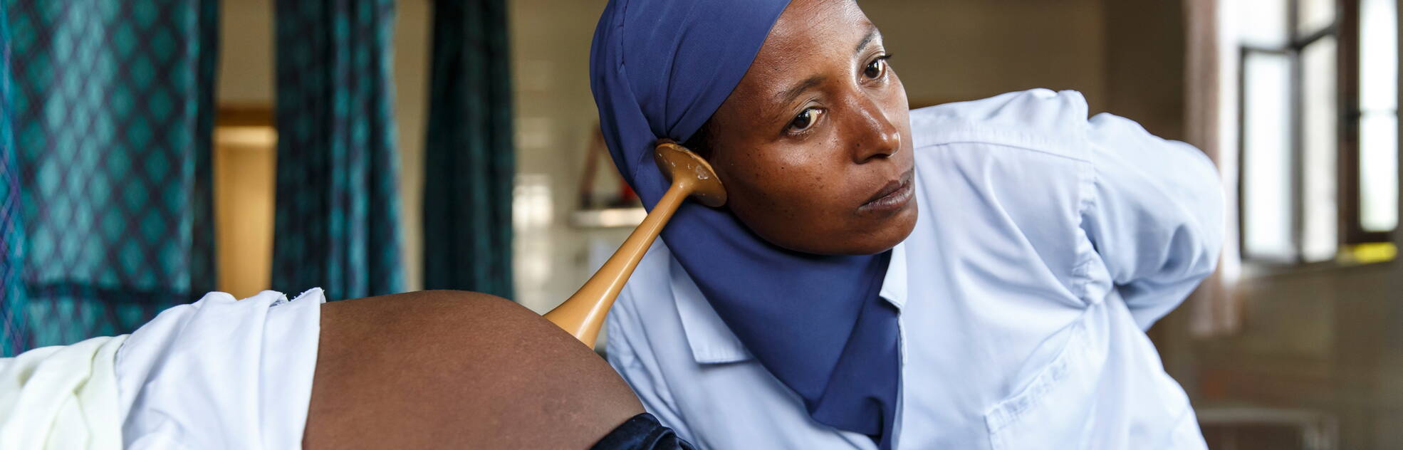 Midwife during an examination, Ethiopia
