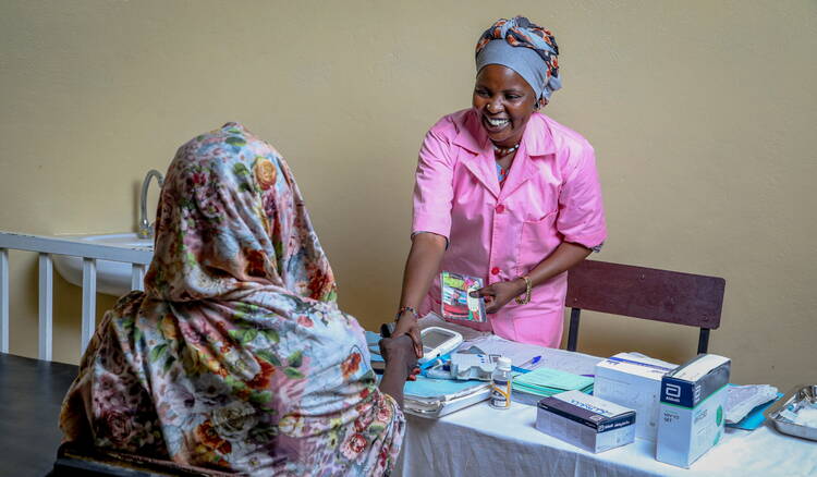 Midwife and Patient in Maternité, Chad Midwife and Patient in Maternité, Chad